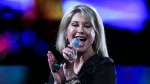 FILE - In this Thursday, Feb. 23, 2017 file photo, Olivia Newton-John performs during the Vina del Mar International Song Festival at the Quinta Vergara in Vina del Mar, Chile. (AP Photo/Esteban Felix, File)