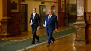 Peter Bethlenfalvy, Ontario's Minister of Finance, left, arrives with Premier Doug Ford to deliver the provincial government's 2022 budget at the Queens Park Legislature, in Toronto, on Thursday, April 28, 2022. THE CANADIAN PRESS/Chris Young 