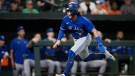 Toronto Blue Jays' Bo Bichette runs toward home to score on a single by Raimel Tapia during the eighth inning of a baseball game, Monday, Aug. 8, 2022, in Baltimore. The Orioles won 7-4. (AP Photo/Nick Wass)