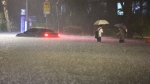 A vehicle is submerged in a flooded road in Seoul, South Korea, Aug. 8, 2022. (Hwang Kwang-mo/Yonhap via AP)