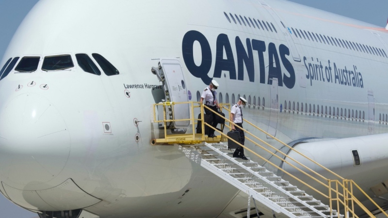 Crew members leave a Qantas Airbus A380 after it arrived at Southern California Logistics Airport in Victorville, Calif., on July 6, 2020. (Matt Hartman / AP) 