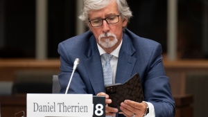 Former Privacy Commissioner of Canada Daniel Therrien uses his mobile phone as he waits to appear before the Standing Committee on Access to Information, Privacy and Ethics, Tuesday, August 9, 2022 in Ottawa. THE CANADIAN PRESS/Adrian Wyld