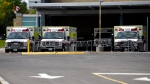 Ambulances are parked outside the Emergency Department at the Ottawa Hospital Civic Campus in Ottawa on Monday, May 16, 2022. THE CANADIAN PRESS/Justin Tang