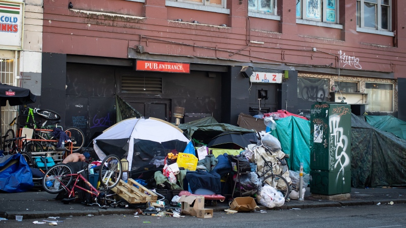 Tents line the sidewalk on East Hastings Street in the Downtown Eastside of Vancouver, on Thursday, July 28, 2022. Vancouver's fire chief issued an order to remove a growing homeless camp along East Hastings Street due to urgent safety concerns including fire risk. THE CANADIAN PRESS/Darryl Dyck