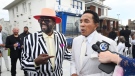 Original Temptation Otis Williams, left, and Smokey Robinson speak in front of the Motown Museum during a celebration for the completion of two of three phases of an ambitious expansion plan for the museum, including a new square/courtyard in front of the property, in Detroit, Monday, Aug. 8, 2022. (Daniel Mears/Detroit News via AP)