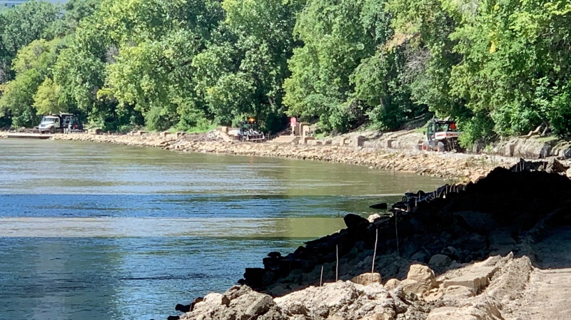 Crews working on cleaning up the River Trail after high water levels left excessive amounts of debris. Aug. 9, 2022. (Source: Scott Andersson/CTV News)