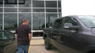 James Chandler looks at new pickup trucks at a dealership after his was stolen from his driveway in Kitchener. (Spencer Turcotte/CTV News)