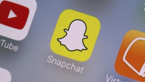 FILE - The Snapchat app is seen on a mobile device in New York, Aug. 9, 2017. (AP Photo/Richard Drew, File)