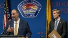 Ahmad Assed, president of the Islamic Centre of New Mexico, left, speaks at a news conference to announce the arrest of Muhammad Syed, a suspect in the recent murders of Muslim men in Albuquerque, N.M., as Albuquerque Mayor Tim Keller listens, at right, Tuesday, Aug. 9, 2022. (Adolphe Pierre-Louis/The Albuquerque Journal via AP)