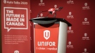 Unifor signage is on display during a press conference announcing a tentative agreement for its 9,000 members working at Fiat Chrysler Automobiles, in Toronto on Thursday, October 15, 2020. THE CANADIAN PRESS/ Tijana Martin