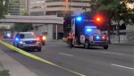 Calgary police investigate a pedestrian hit-and-run collision in the intersection of Fifth Avenue and Macleod Trail S.E. on Tuesday, Aug. 9, 2022. 