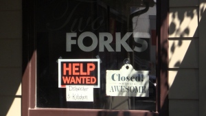 A ‘Help Wanted’ sign is posted in the window of Two Forks Restaurant in Port Stanley, Ont. (Source: Brent Lale/CTV London)