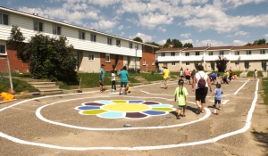 Several groups came together in Sudbury on Wednesday to bring some colour to a housing co-op in the city and provide an opportunity for the children who live there to use their imagination and play. (Lyndsay Aelick/CTV News)