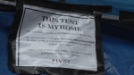A sign is seen on a tent in the Downtown Eastside on Aug. 10, 2022. (CTV)