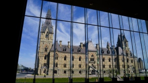The West Block of Parliament Hill is pictured through the window of the Sir John A Macdonald building in Ottawa, May 11, 2022. THE CANADIAN PRESS/Sean Kilpatrick