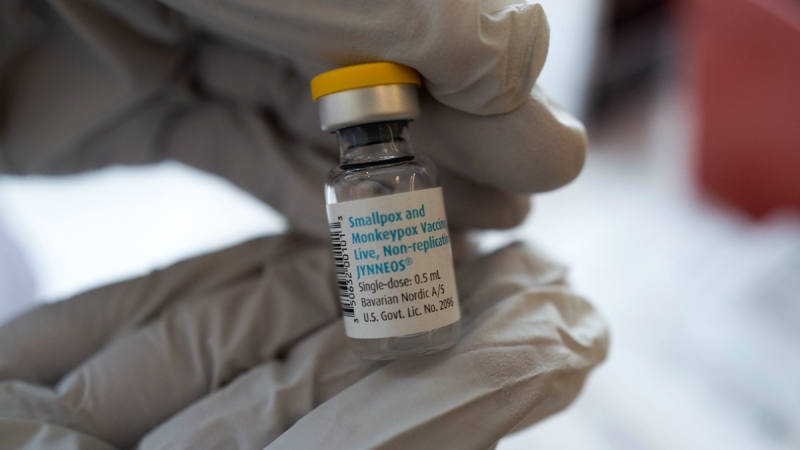Holding a bottle of Monkeypox vaccine at a Pop-Up Monkeypox vaccination site in West Hollywood, Calif., on Aug. 3, 2022. (Richard Vogel / AP) 
