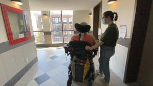 Phil Major is stuck on the 12th floor of his Clarence Street building by an elevator outage. Family friend Allison Anderson visits Major on Thursday. (Natalie van Rooy/CTV News Ottawa) 