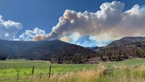 Thick plumes of smoke billow near the community of Olalla as the B.C. Wildfire Service conducts a controlled burn as part of efforts to contain the Keremeos Creek fire. (Jordan Jiang) 