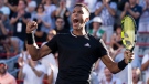 Felix Auger-Aliassime of Canada celebrates after beating Cameron Norrie of Great Britain during round of sixteen play at the National Bank Open tennis tournament, Thursday, August 11, 2022 in Montreal. THE CANADIAN PRESS/Paul Chiasson