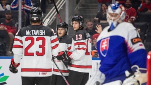 Canada's Mason McTavish (23), Logan Stankoven (10) and Kent Johnson (13) celebrate a goal against Slovakia during second period IIHF World Junior Hockey Championship action in Edmonton on Thursday August 11, 2022 (The Canadian Press/Jason Franson).