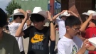 A group of Japanese students get white-hatted in Calgary, Aug. 11, 2022