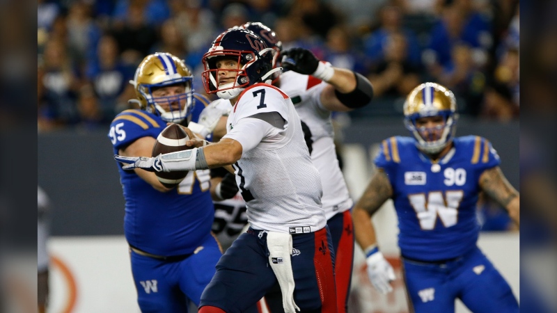 Montreal Alouettes quarterback Trevor Harris (7) throws against the Winnipeg Blue Bombers during second half CFL action in Winnipeg Thursday, August 11, 2022. THE CANADIAN PRESS/John Woods