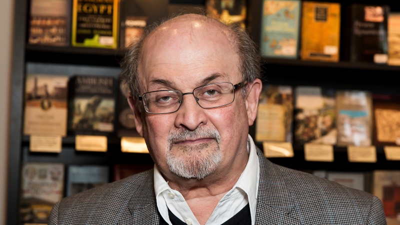 FILE - Author Salman Rushdie appears at a signing for his book "Home" in London on June 6, 2017. (Photo by Grant Pollard/Invision/AP, File)