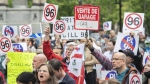 People take part in a protest against Bill 96 in Montreal on May 26, 2022. A Quebec Superior Court judge has temporarily struck down two articles of the province's new language law, saying they could prevent some English-speaking organizations from accessing justice through the courts. THE CANADIAN PRESS/Graham Hughes