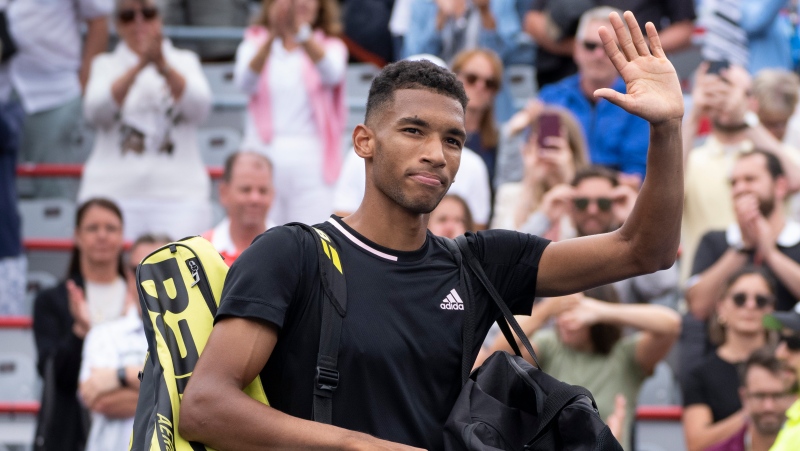 Canada's Felix Auger-Aliassime walks off the court after losing to Casper Ruud of Norway for his win in quarterfinal play at the National Bank Open tennis tournament, Friday, August 12, 2022 in Montreal. THE CANADIAN PRESS/Paul Chiasson