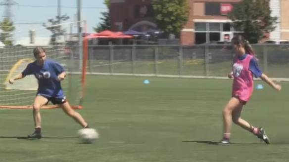 Youth practice their soccer skills at Rim Park on Aug. 12. (Tyler Kelaher/CTV News Kitchener)