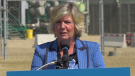 Minister of Environment and Parks Whitney Issik takes questions from reporters near Fort Saskatchewan on August 12, 2022 (Darcy Seaton/CTV News Edmonton).