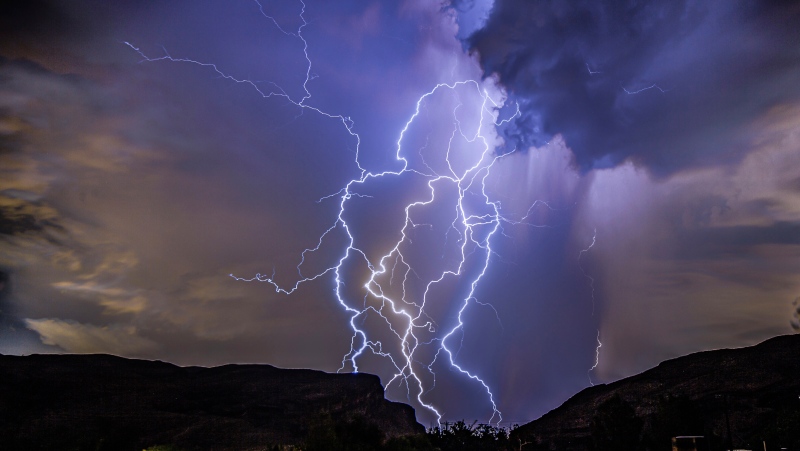 In this photo provided by Dakota Snider, a thunderstorm is seen from Highway 159 over Las Vegas on Thursday, Aug. 11, 2022. (Dakota Snider via AP)