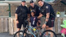 Ottawa police officers in the Suburban West Neighbourhood Resource Team delivered a new bike to an 8-year-old boy whose bike was stolen Aug. 3, 2022. (Ottawa Police Service/Facebook)
