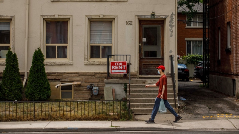 A for rent sign outside a home in Toronto, July 12, 2022. THE CANADIAN PRESS/Cole Burston