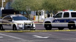 In this file photo, police cars close off a street outside the Sandra Day O'Connor U.S. Courthouse in Phoenix, Ariz., Sept. 15, 2020. (AP Photo/Ross D. Franklin)