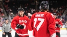 Canada's Ronan Seeley (8) and Ridly Grieg (17) celebrate a goal against Czechia during second period IIHF World Junior Hockey Championship action in Edmonton on Saturday August 13, 2022 (The Canadian Press/Jason Franson).