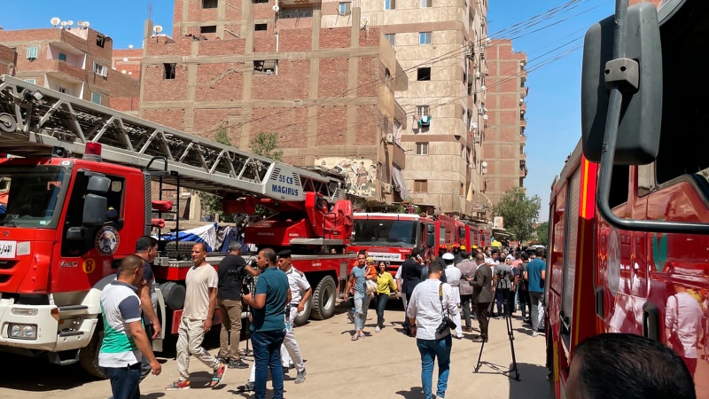 Emergency personnel work at the site of a fire at the Abu Sefein church that has killed over 40 people and injured at least 14 others, in the densely populated neighbourhood of Imbaba, Cairo in Egypt on Aug. 14, 2022. The church said the fire broke out while a service was underway. The cause of the blaze was not immediately known but a Police said an initial investigation blamed an electrical short-circuit. (AP Photo/Mohamed Salah)