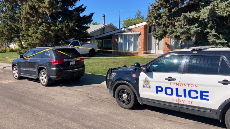 Edmonton police outside a home in the area of 83 Avenue and 159 Street on Sunday, Aug. 14, 2022. (CTV News Edmonton)
