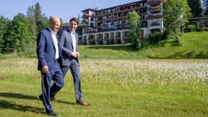 Prime Minister Justin Trudeau and Olaf Scholz, Chancellor of Germany take a stroll at the G7 Summit in Schloss Elmau on Monday, June 27, 2022. THE CANADIAN PRESS/Paul Chiasson