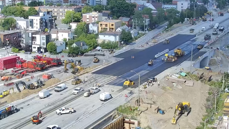 Construction crews continue work to replace the Booth Street Bridge along the Queensway on Sunday afternoon. (CEECAM Corporation/YouTube)