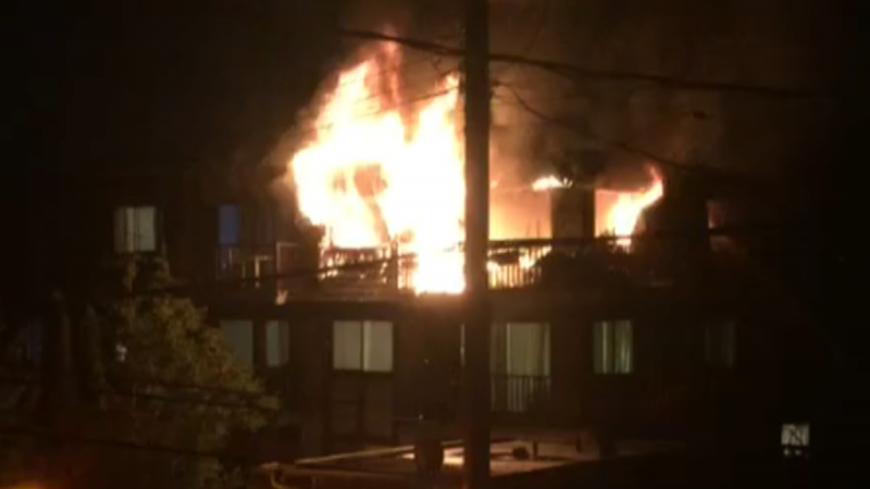 This still image from a video submitted by Billy-Joe Thorpe shows a fire engulfing a Burnaby apartment on Sunday, Aug 14, 2022. 
