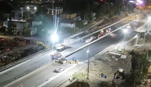 Construction crews continued working Sunday evening on the Queensway following the replacement of the Booth Street Bridge. (CEECAM Corporation/YouTube) 
