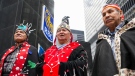 Wet'suwet'en Chiefs Namoks, left, Madeek, centre, and Gisdywa traveled to confront and protest Royal Bank of Canada's funding of Coastal GasLink pipeline and other fossil fuel investments in Toronto on Thursday, April 7, 2022. THE CANADIAN PRESS/Nathan Denette