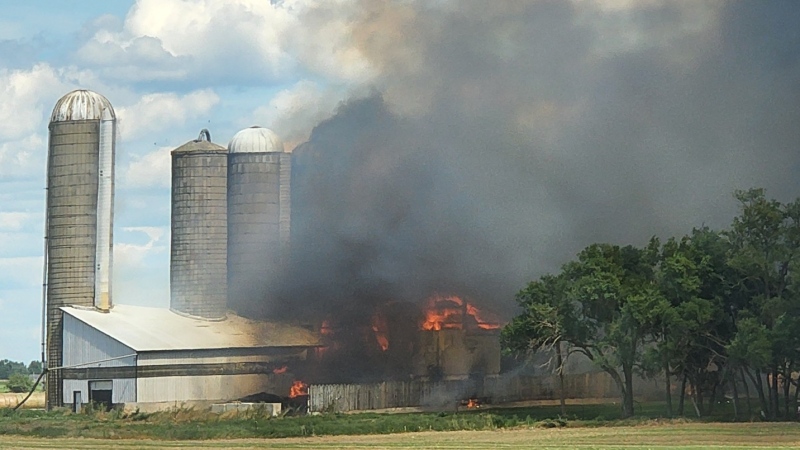 Smoke rises in the air during a barn fire on Aug. 15. (Karen Vollmer/Submitted)