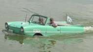 Sask. couple Stan Brenner and Karla Sastaunik take their Amphicar for a ride on the lake. (Stacey Hein / CTV News) 