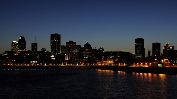 A dimmed Montreal skyline can be seen a couple of minutes after 8pm on earth day, Saturday March 29, 2008.(Graham Hughes / THE CANADIAN PRESS)