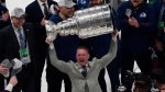 Colorado Avalanche skills coach Shawn Allard lifts the Stanley Cup after the team defeated the Tampa Bay Lightning 2-1 in Game 6 of the NHL hockey Stanley Cup Finals on Sunday, June 26, 2022, in Tampa, Fla. (John Bazemore/AP Photo) 