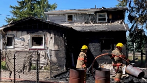 Firefighters at the scene of a house fire in Clanderboye, Ont. on Aug. 16, 2022. The structure is a “total loss” according to the local fire chief. (Sean Irvine/CTV London) 
