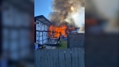 The Saskatoon Fire Department says accidental improper disposal of smoking material caused a Monday morning blaze where nine cats were rescued and $350,000 in damage was caused.