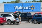 On August 16, Walmart offered a much rosier picture for consumer spending than it had forecast just a month earlier, as the company's steep discounts led customers to shop more. A woman loads groceries into her car at a Walmart in Pennsylvania on August 12. Photo by Paul Weaver/SOPA Images/LightRocket/Getty Images via CNN